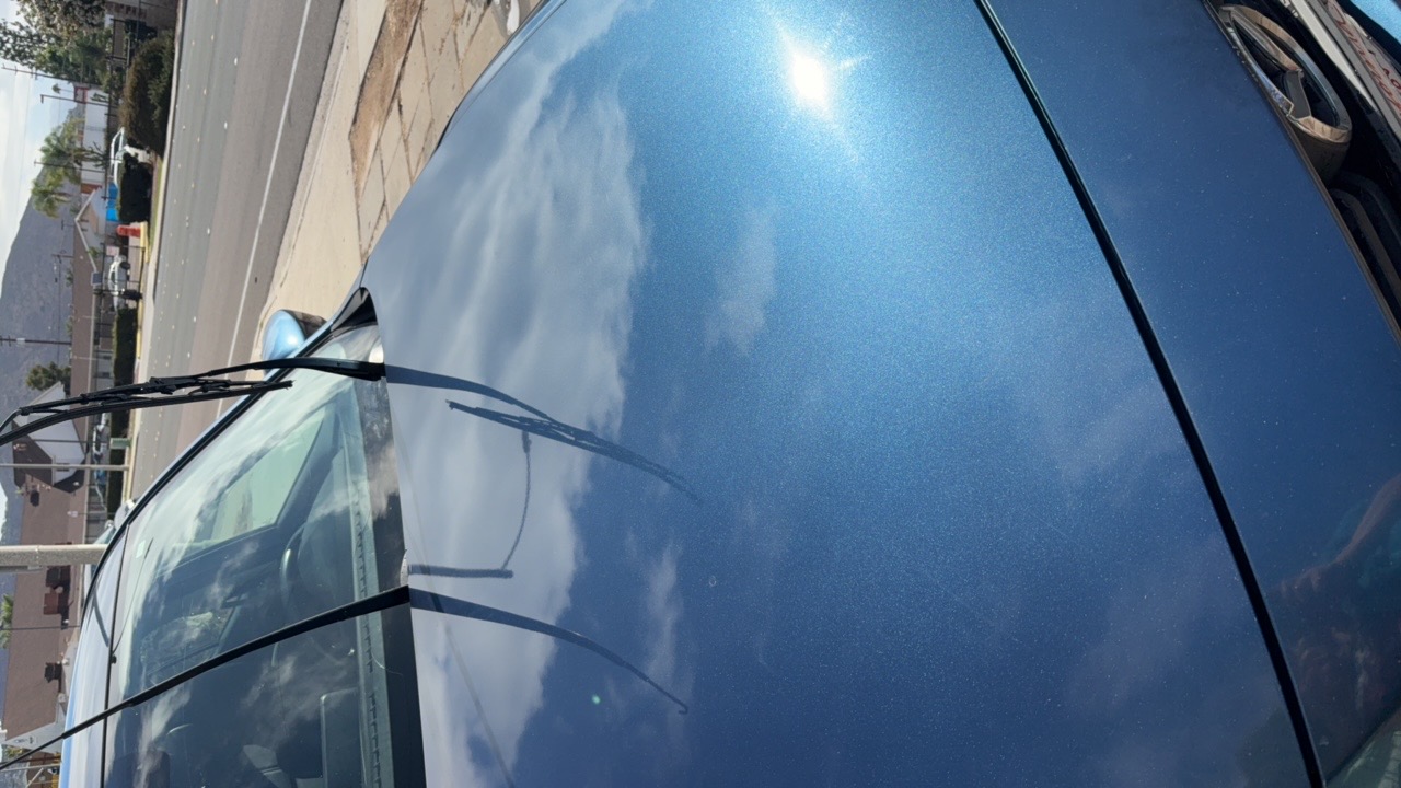 Blue sedan hood gloss