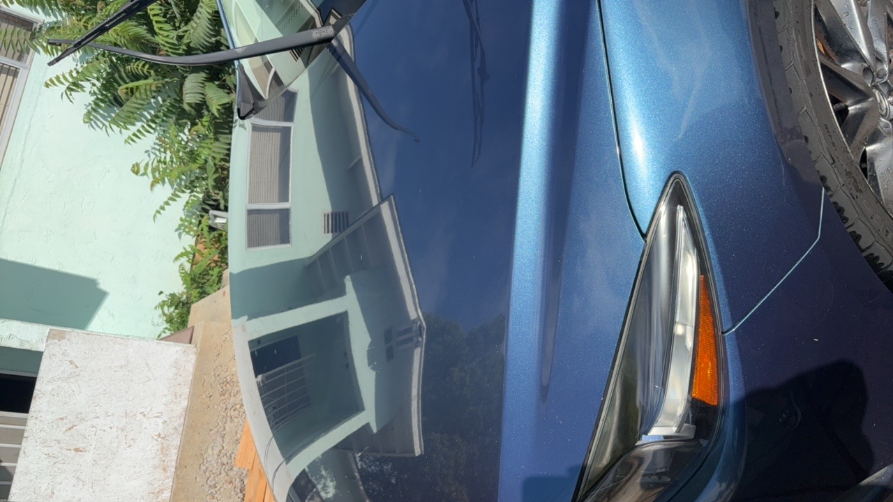 Blue sedan hood detail