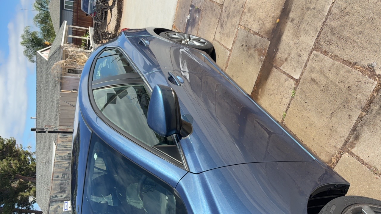 Blue Mazda side profile